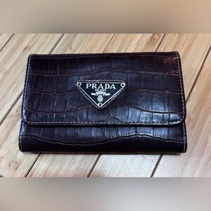 Prada crocodile wallet. Brown. Zipper is broken. See pic.